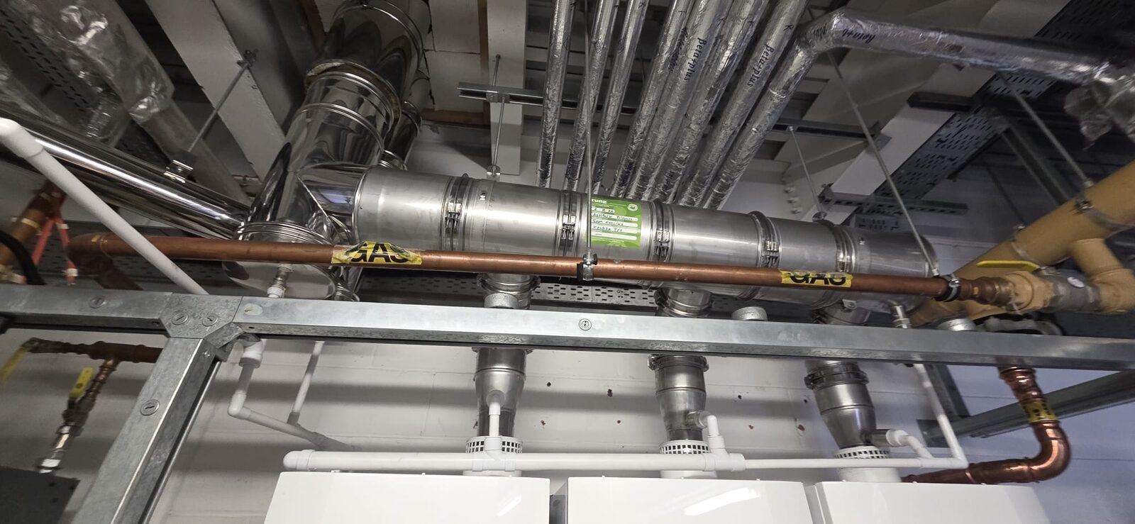 New flue and gas header pipework serving the boiler cascade at Ashpark Primary School